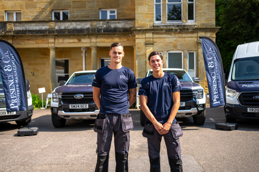 Monty and Aaron by Presence & Co. branded trucks and flags