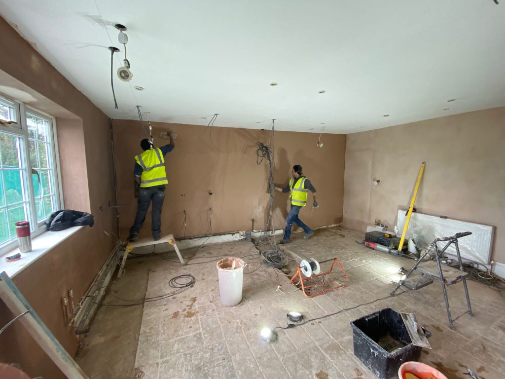 presence & co. technicians working on redecorating a wall