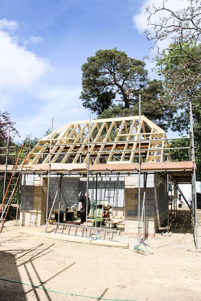 construction site on a residential home with scaffolding added around