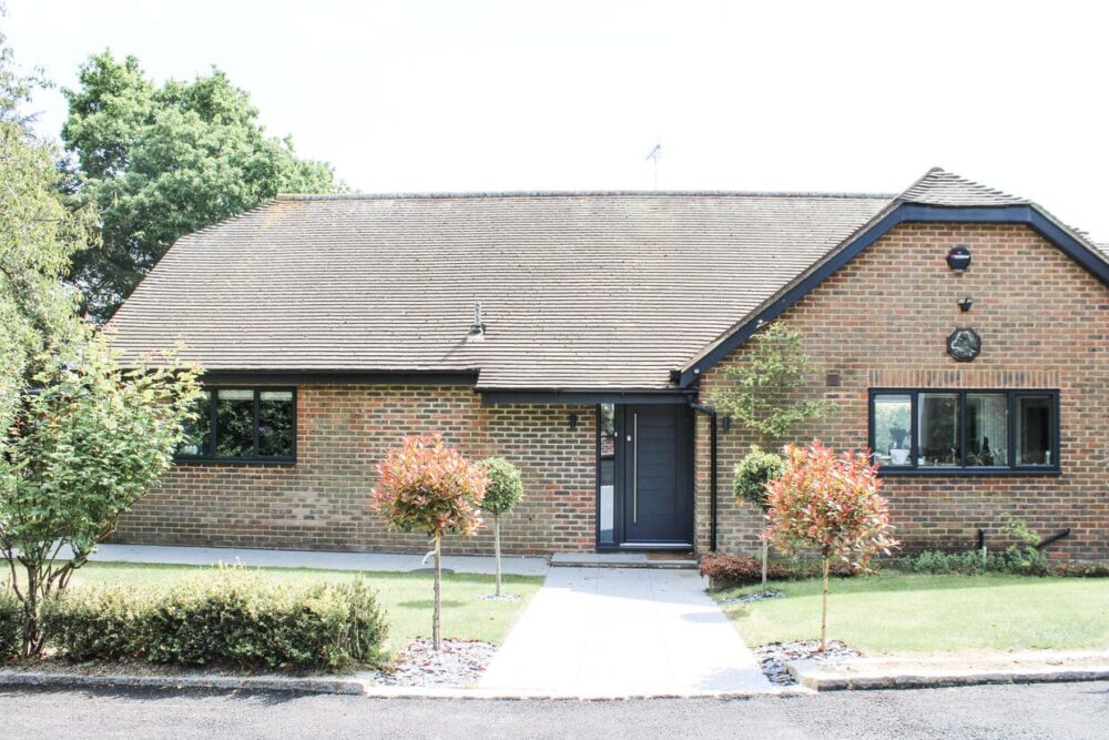 residential bungalow in the heart of Tunbridge wells, surrounded by orange greenery and a black door