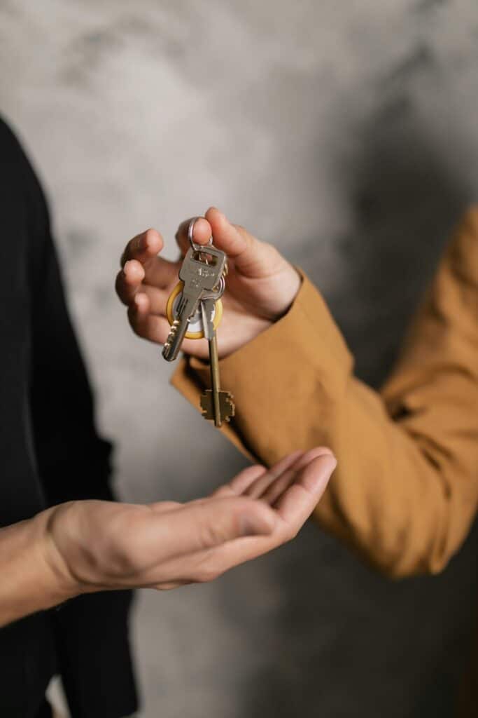 landlord handing over management keys to a managing agent.