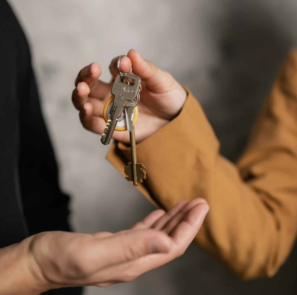 landlord handing over management keys to a managing agent.
